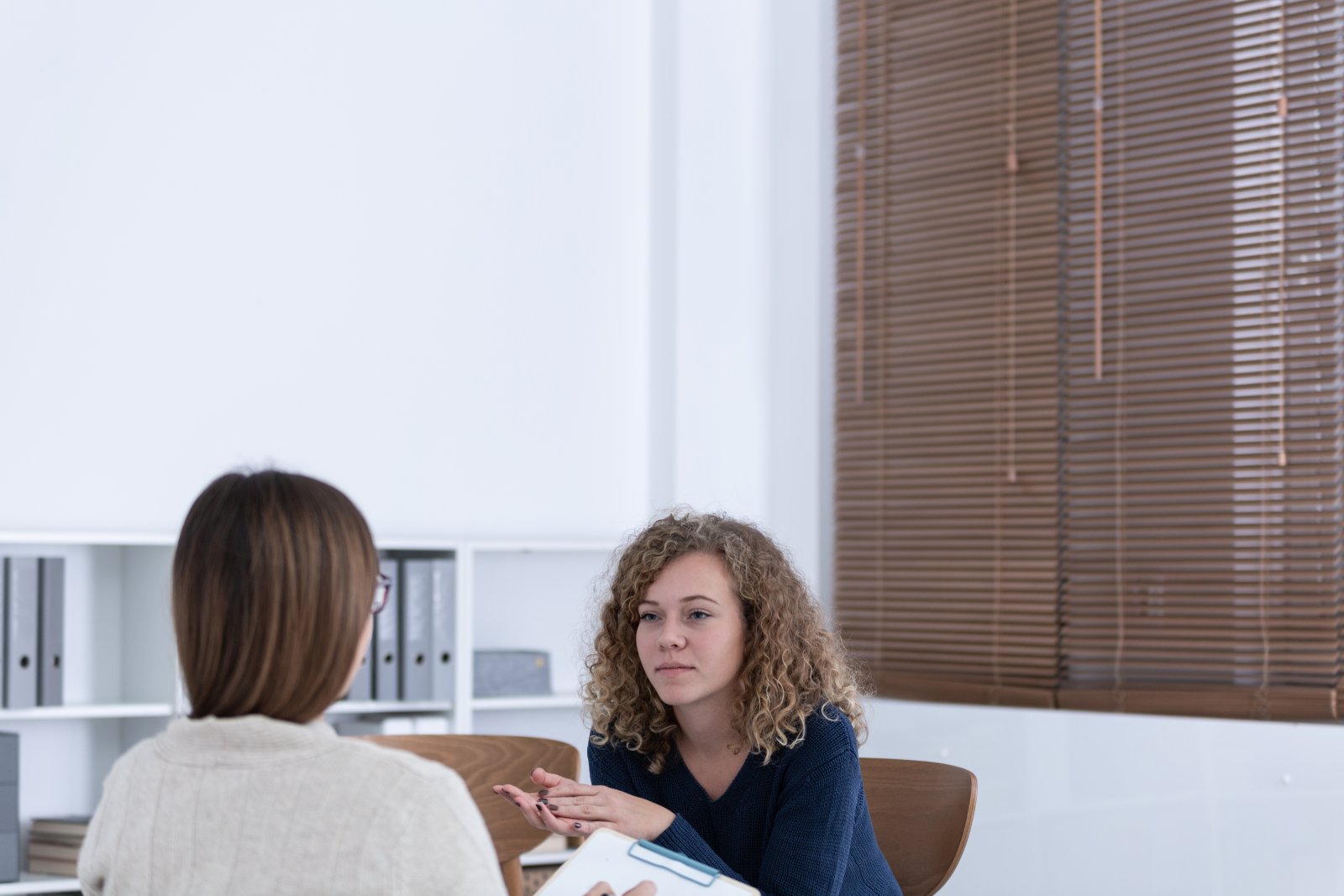 professional-counselor-and-woman-suffering-from-de-2024-10-18-08-40-06-utc